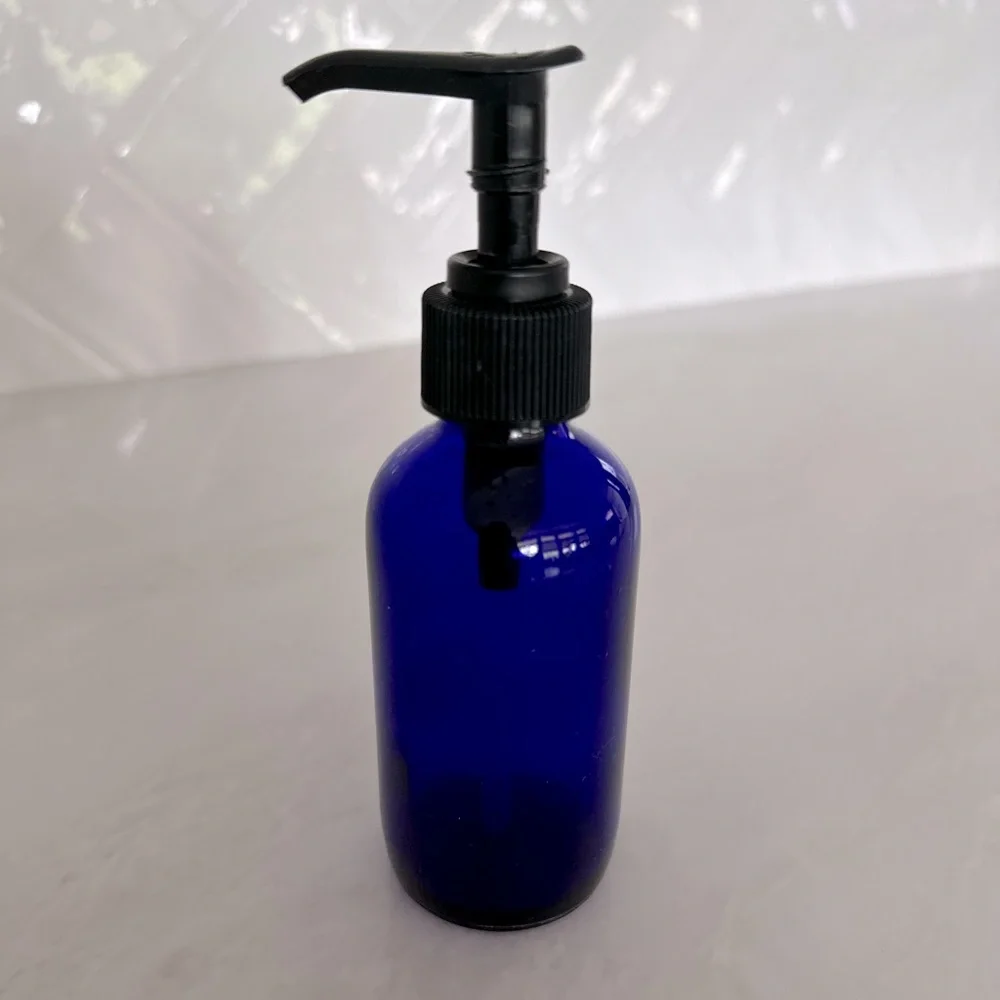Cobalt blue glass lotion bottle